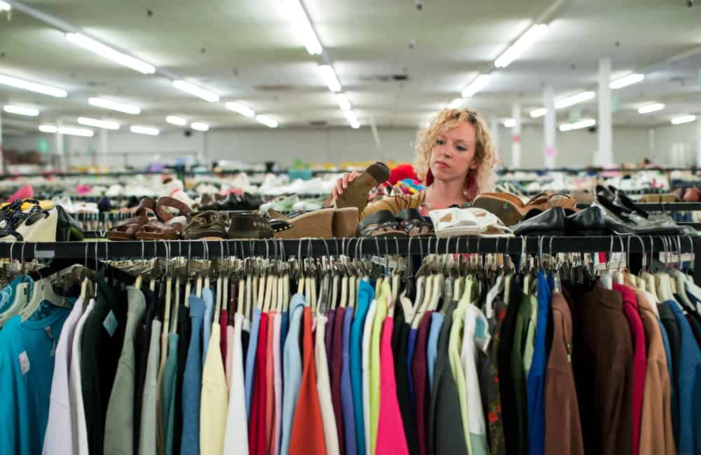 Woman shopping a shoe on a thrift store